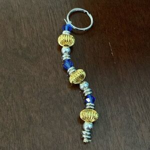 Silver, gold, and blue keychain